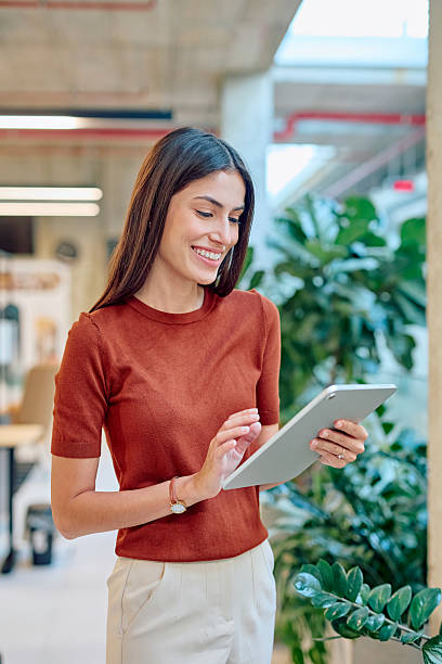 istock Young businesswoman using digital tablet in modern office building 2227426917