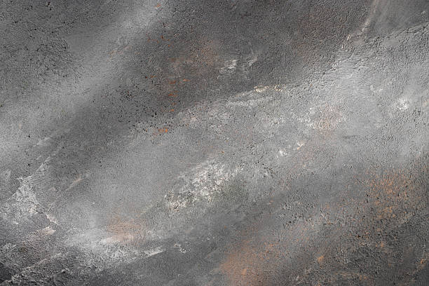 istock Rough gray concrete surface with natural rust and texture variations for industrial design 2227428814