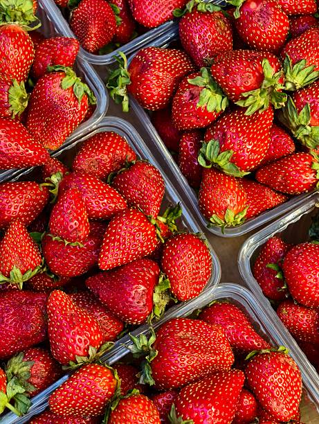 istock Ripe strawberries packaged for sale 2227430671