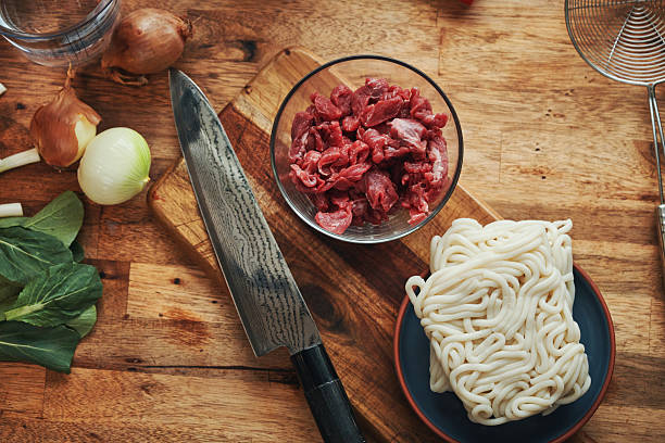 istock Preparing Kake Udon Noodle Soup with Broth and Green Onions 2227430679