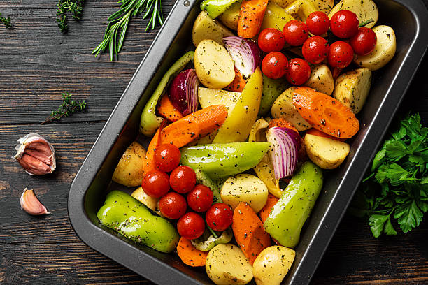 istock Seasonal vegetables on baking tray ready to cook 2227431042
