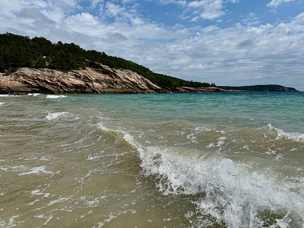 The Ocean Path Trail meanders along vast slabs of pink granite, picturesque cliffs, and breathtaking oceans views of the striking coast of Maine. The Ocean Path is a great way to access Thunder Hole and Otter Point from Sand Beach on a gradual hike. This picturesque hike is a great way to experience  Acadia National Park.