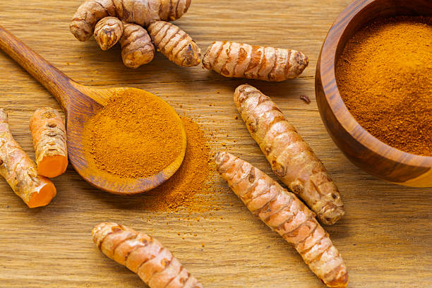 istock Fresh and Ground Turmeric on Rustic Background  Natural Health and Culinary Ingredient 2227432251