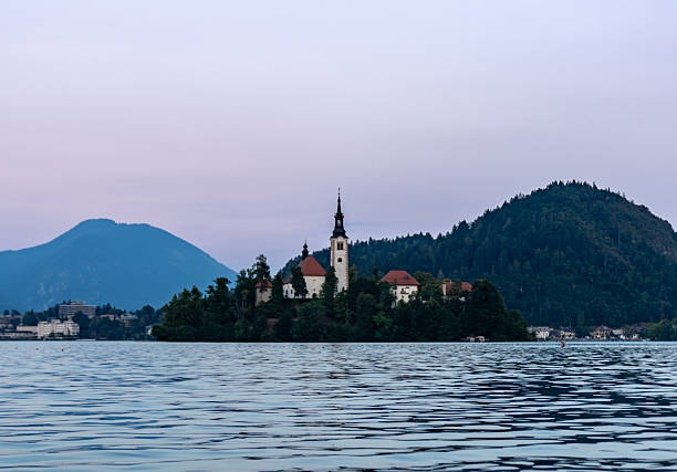istock Peaceful twilight over Lake Bled with island church and mountain reflections 2227433574
