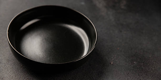 istock Plate black tableware empty dinnerware ready to serve dishes ready to serve dishes dinnerware serving dishes food ceramic plate on the table background food 2227433626