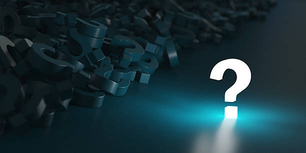 istock Glowing question mark near a pile of question marks. Idea or problem concept background. 2227433705