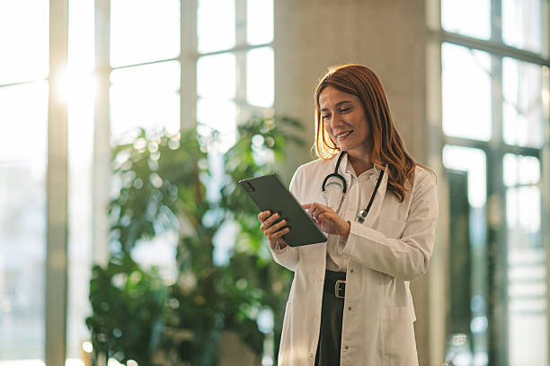 istock Female doctor using digital tablet in modern hospital 2227433922