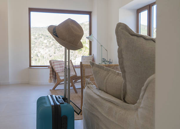 Suitcases, airplane ticket and passport preparing for a vacation
