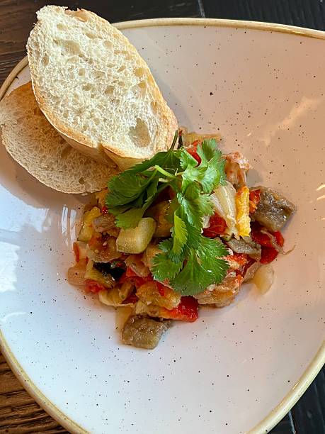 Vegetable stew served with slices of crusty bread
