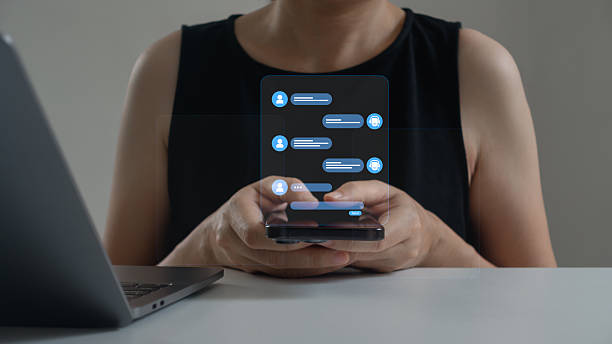 istock AI Chatbot conversation assistant concept. Woman using mobile phone with chat bot app to get support for online customer service. AI automatic answering machine. Artificial Intelligence, Contact Us. 2227441264