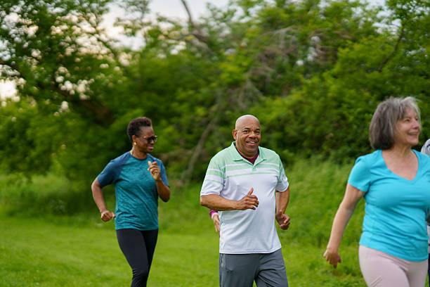 istock Active Seniors Jogging Outdoors in a Scenic Park Setting 2227444558