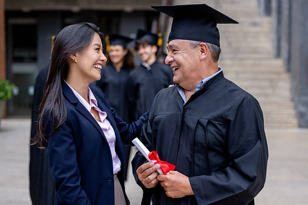 istock Happy daughter congratulating her father on his graduation day 2227445687