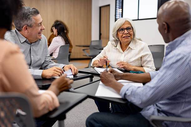 istock Woman studying at the university and talking to her classmates in a debate 2227445728