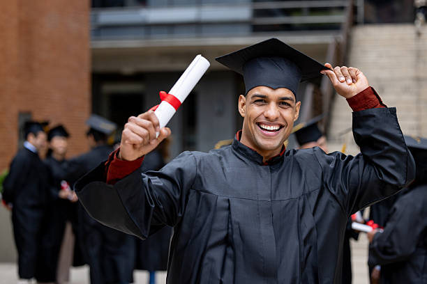 istock Happy student celebrating his graduation and holding his diploma 2227445790