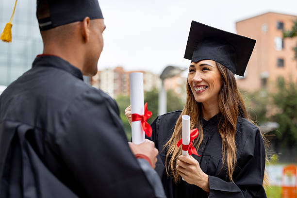 istock Happy post-graduate students celebrating on their graduation 2227445802