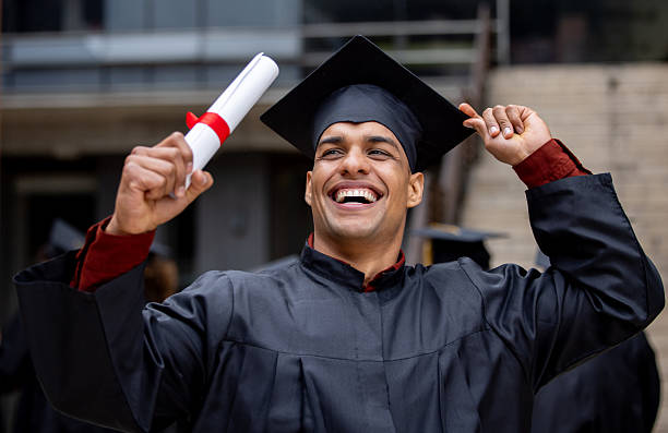istock Post-graduate student celebrating his graduation and holding his diploma 2227445805