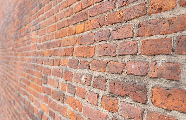 istock texture dark brick wall of old castle, ancient red stone background. 2227445878