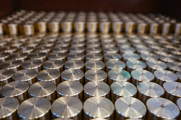 istock Cylindrical spare parts in rows, close up 2227445980