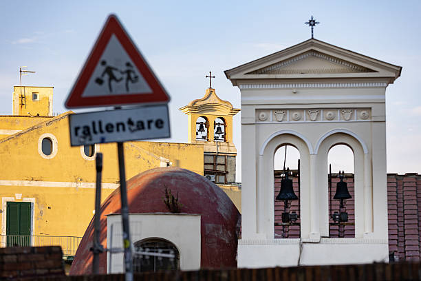 Italy. Pozzuoli. Children sign and church.