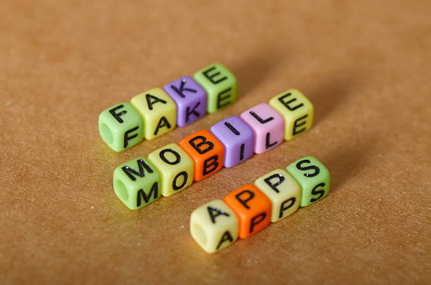 istock Words 'Fake Mobile Apps' Diagonally  Visual Metaphor for Online App Scams 2227446849