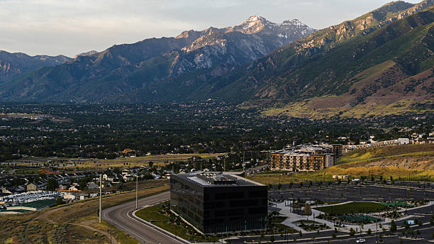 Utah County valley with snow-capped mountains. Office building near Traverse Trail in Lehi. stock photo