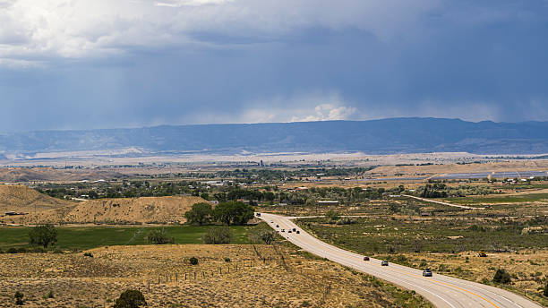 istock Rainstorm approaching Utah valley. Rural route traverses arid landscape in Carbon County. 2227448425