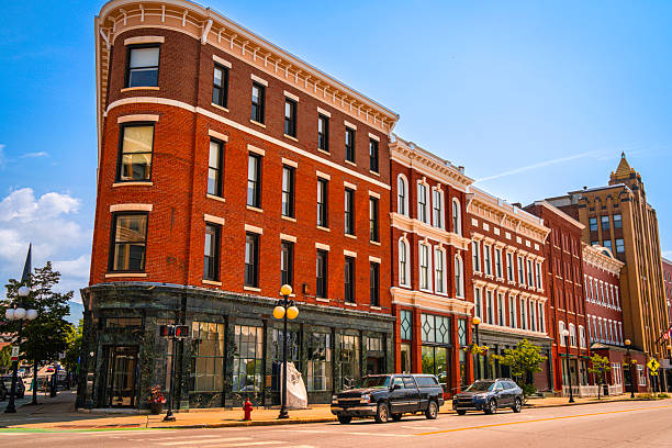 Store fronts along the main road in Mason Ohio. There is a pedestrian crosswalk leading edge into the row of local shops.