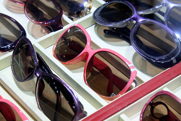 Color frame sunglasses on the shelf, closeup of photo