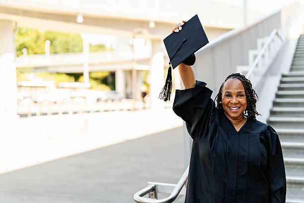 istock An Older Graduate with Cap and Gown 2227454393