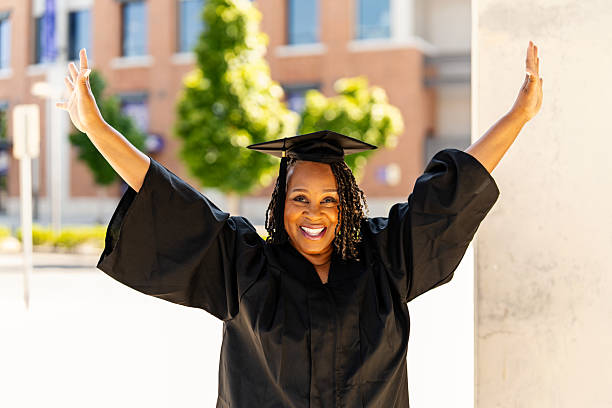 istock An Older Graduate with Cap and Gown 2227454395