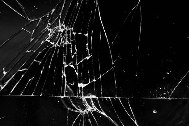 istock cracked glass isolated in black background 2227456111