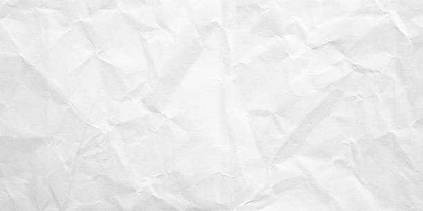 istock White folded and wrinkled paper texture background 2227456116