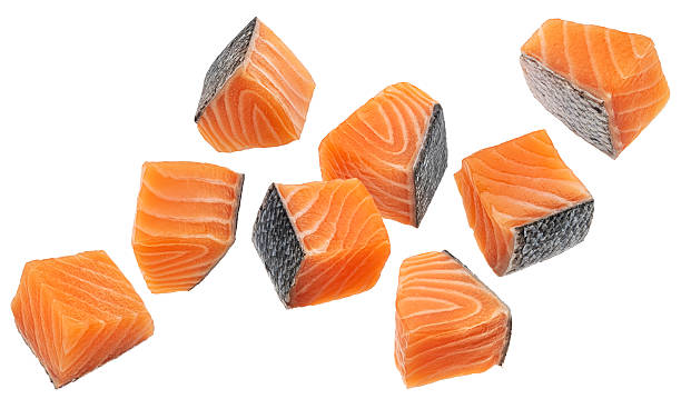 istock Salmon fillet cubes isolated on white background with clipping path 2227456376