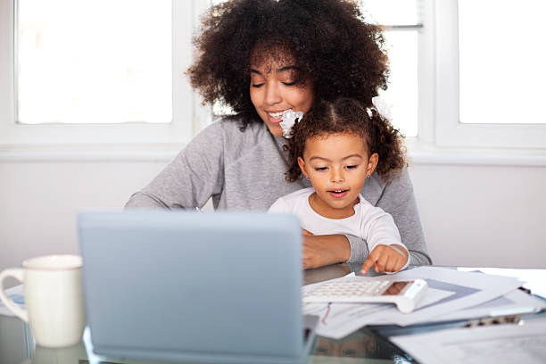istock Young mother working and spending time with her daughter 2227458852