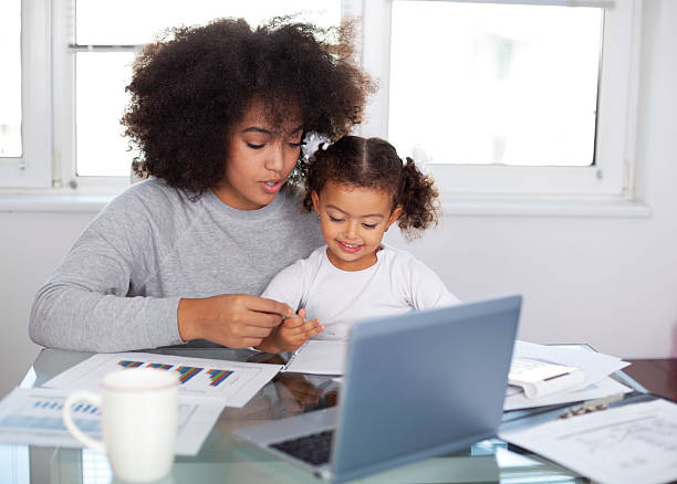istock Young mother working and spending time with her daughter 2227458967