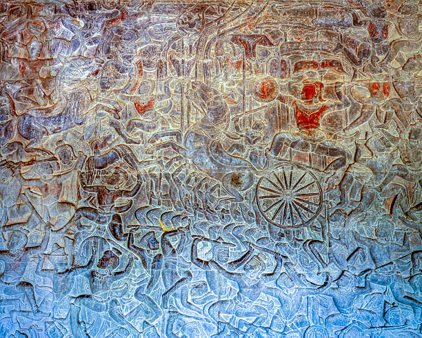 Bas-relief carved in sandstone in Khmer style depicting the battle between devas (gods) and asuras (demons) from Hindu mythology, located in the first gallery of Angkor Wat.