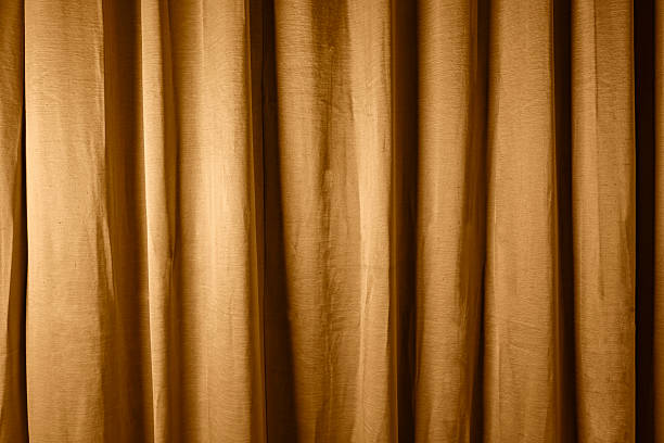 istock Golden satin silk with crumpled abstract texture background. Material textile surface. Copy space 2227468351