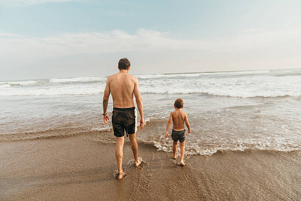 istock Father and son at the  beach 2227474150