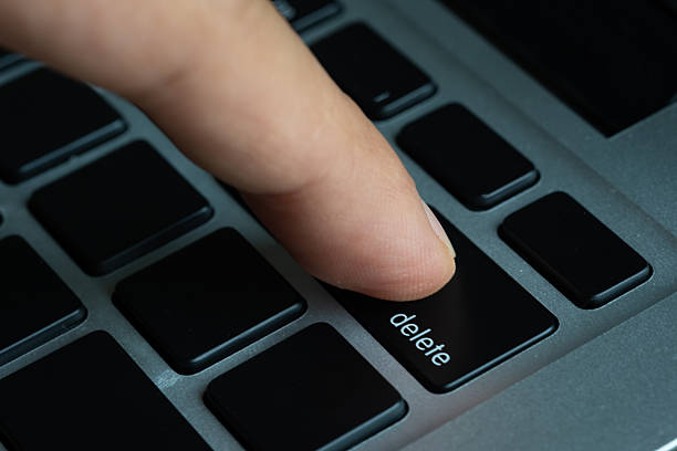 istock Finger of the computer user, he presses the delete button on the computer keyboard. 2227477826