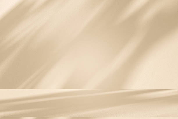 istock Studio style background wall decoration presentation uses white and beige tones. with shadows cast from a nearby window, concept creating a decorative 2227477872