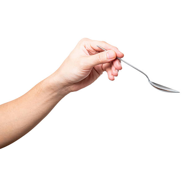 istock Male hand holding a black plastic spoon isolated on white background. 2227481341