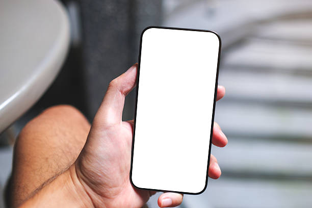 istock Mockup image of a man holding mobile phone with blank white screen in cafe 2227483250