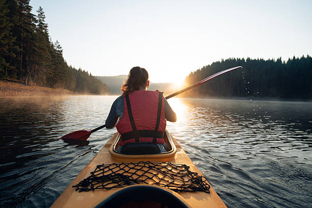 istock Morning kayaking in mountain lake. 2227489478