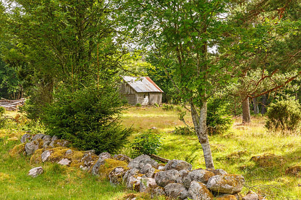 Igaliku, Greenland, Denmark - August 14nd 2024: Old residential house in the small city which has been a major place for farming, but today is mostly known as a tourist town and some the houses are being converted into summerhouses. The house is built of stones which are very unusual in Greenland. A major part of the stones originate from the Gadar ruins, which are remains from the Norsemen who lived here until their disappearance in the beginning of the 15th century.