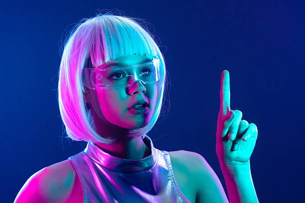 istock Futuristic woman in neon light pointing up 2227492639