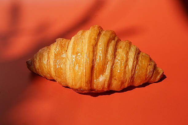 Close up plain butter croissant on marbled background