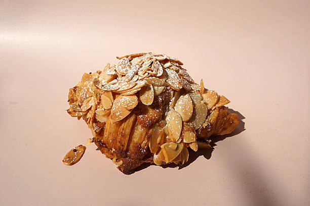 istock Close up Almond croissant on white table 2227497591
