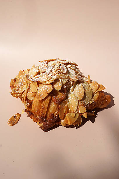 istock Close up Almond croissant on white table 2227497608
