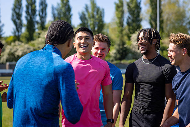 istock Laughing and Bonding on the Football Field 2227501314