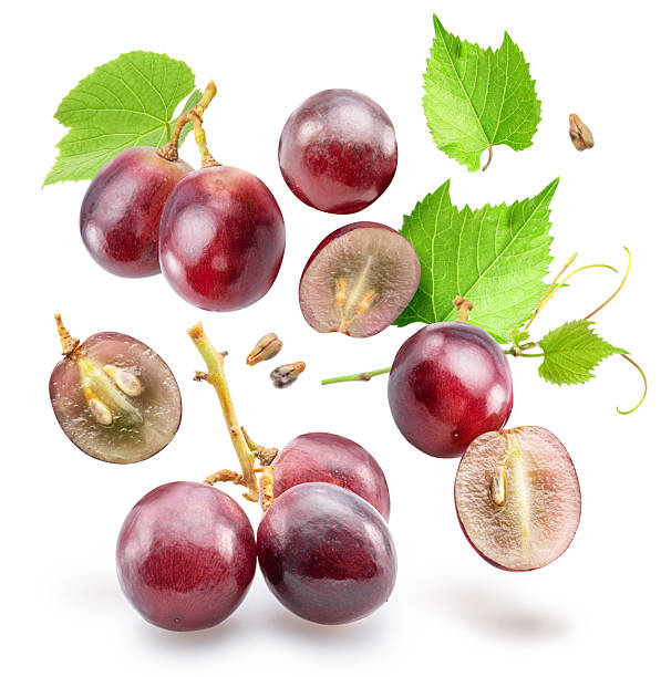 istock Red grape berries with grape leaves levitating in air on white background. File contains clipping paths. 2227503835
